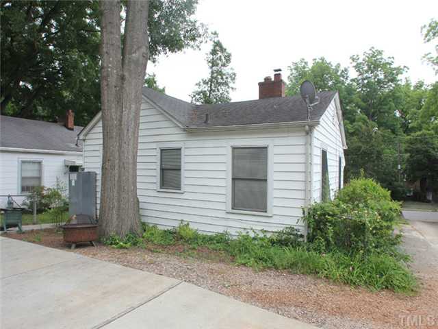 2812 Kilgore Avenue Raleigh, NC 27607 - Photo 3 of 5 a front view of a house with a yard and garage