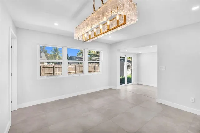 a view of wooden floor and windows in kitchen