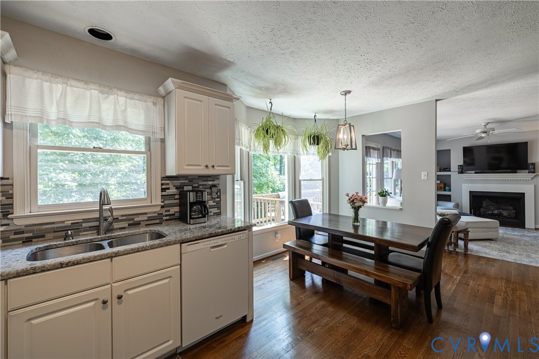 4501 Foxwood Road Chester, VA 23831 - Photo 14 of 42 Kitchen featuring white cabinetry, granite counter