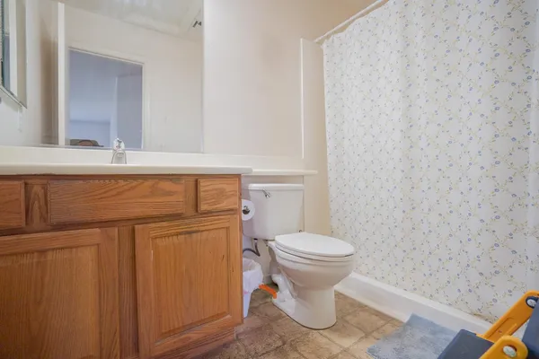 a bathroom with a toilet and a sink