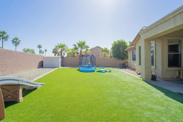 a view of yard with swimming pool