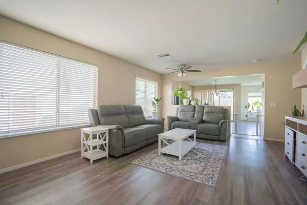 a living room with furniture or couch and a wooden floor