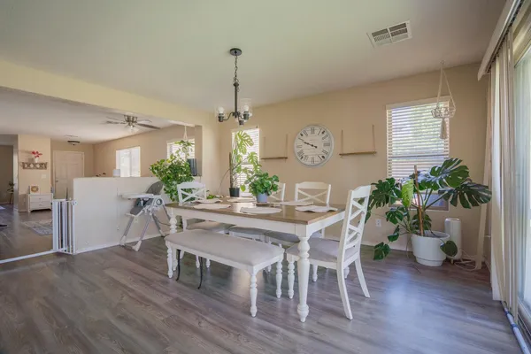 a view of a dining room with furniture window and wooden floor