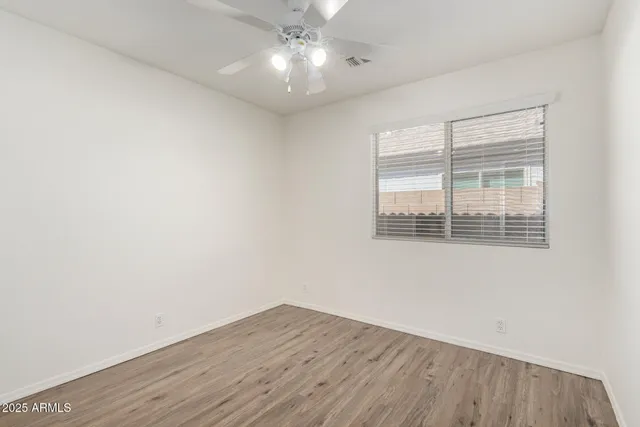 a bedroom with a large bed and a large window