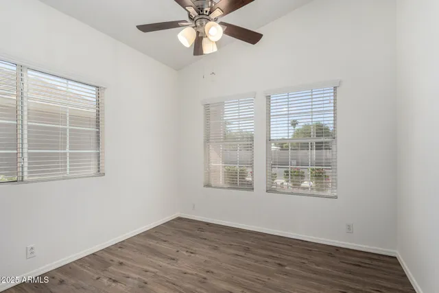 a room that has a window and a table in it
