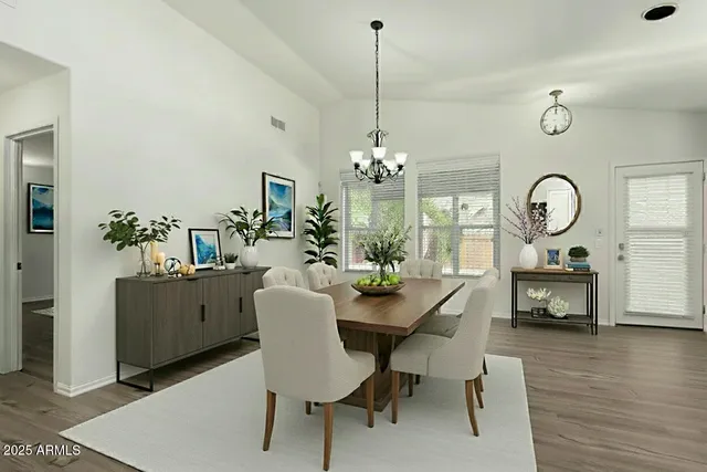 a view of a kitchen with a dishwasher a kitchen island hardwood floor and a ceiling fan
