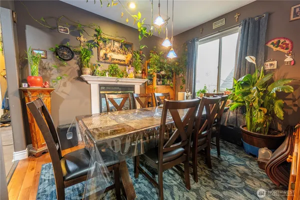 a view of a dining room with furniture and a chandelier