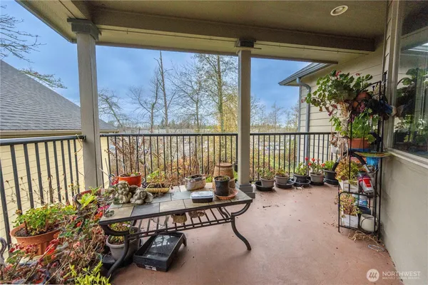 a table and chairs in front of a window