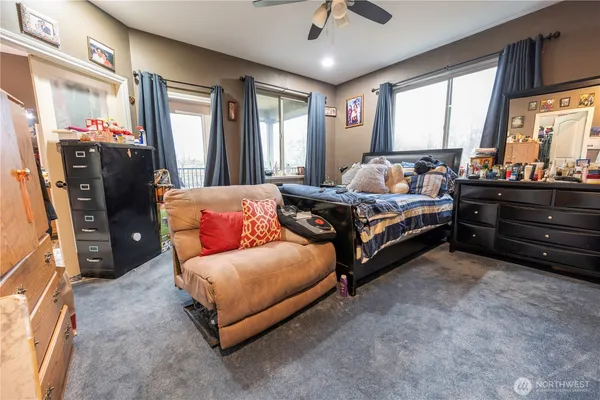 a bedroom with bed and window