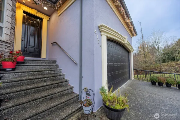 a view of a path along with potted plants