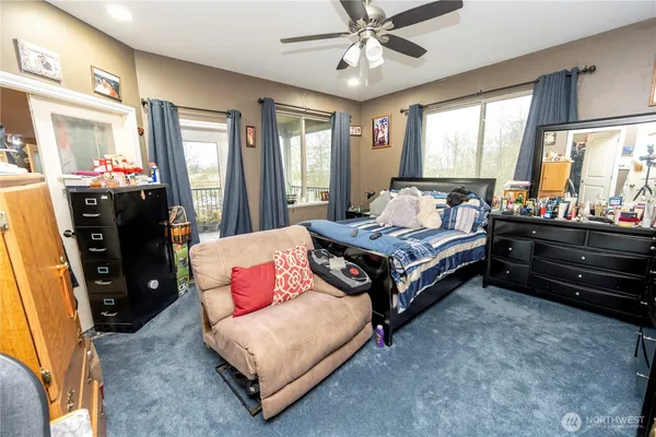 a view of a chairs and table in the balcony