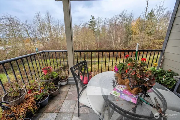 a view of a hallway with entryway and furniture