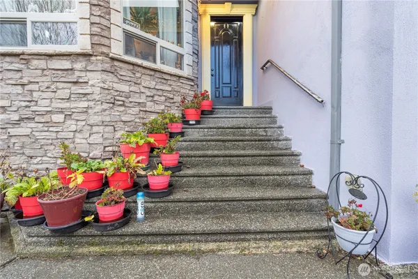 a view of a entryway with flower pots