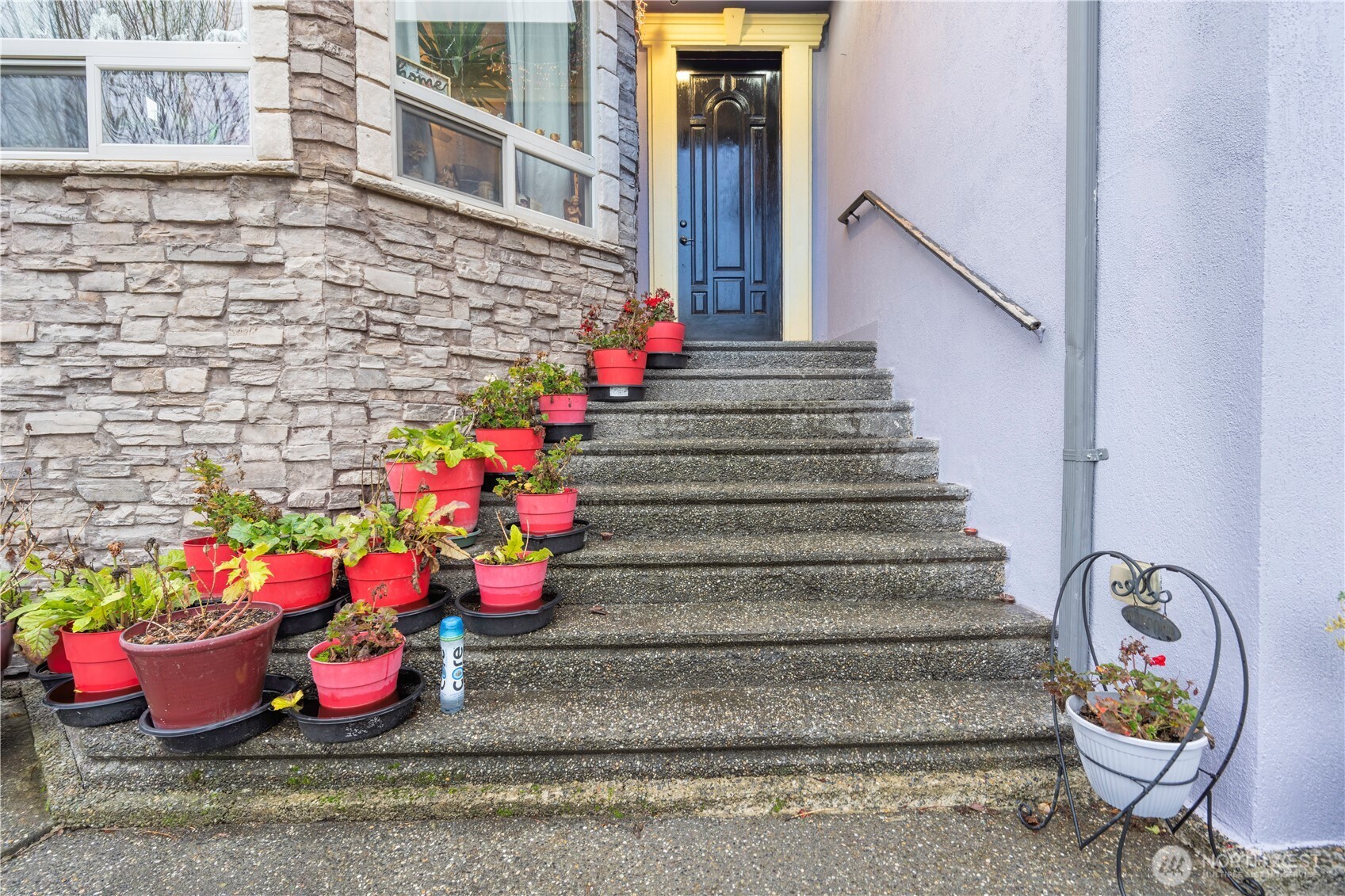 4173 Dover Street Bellingham, WA 98226 - Photo 3 of 40 a view of a entryway with flower pots