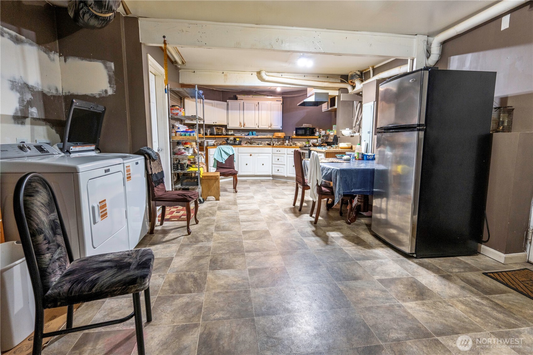 4173 Dover Street Bellingham, WA 98226 - Photo 31 of 40 a open kitchen with stainless steel appliances a refrigerator and table chair
