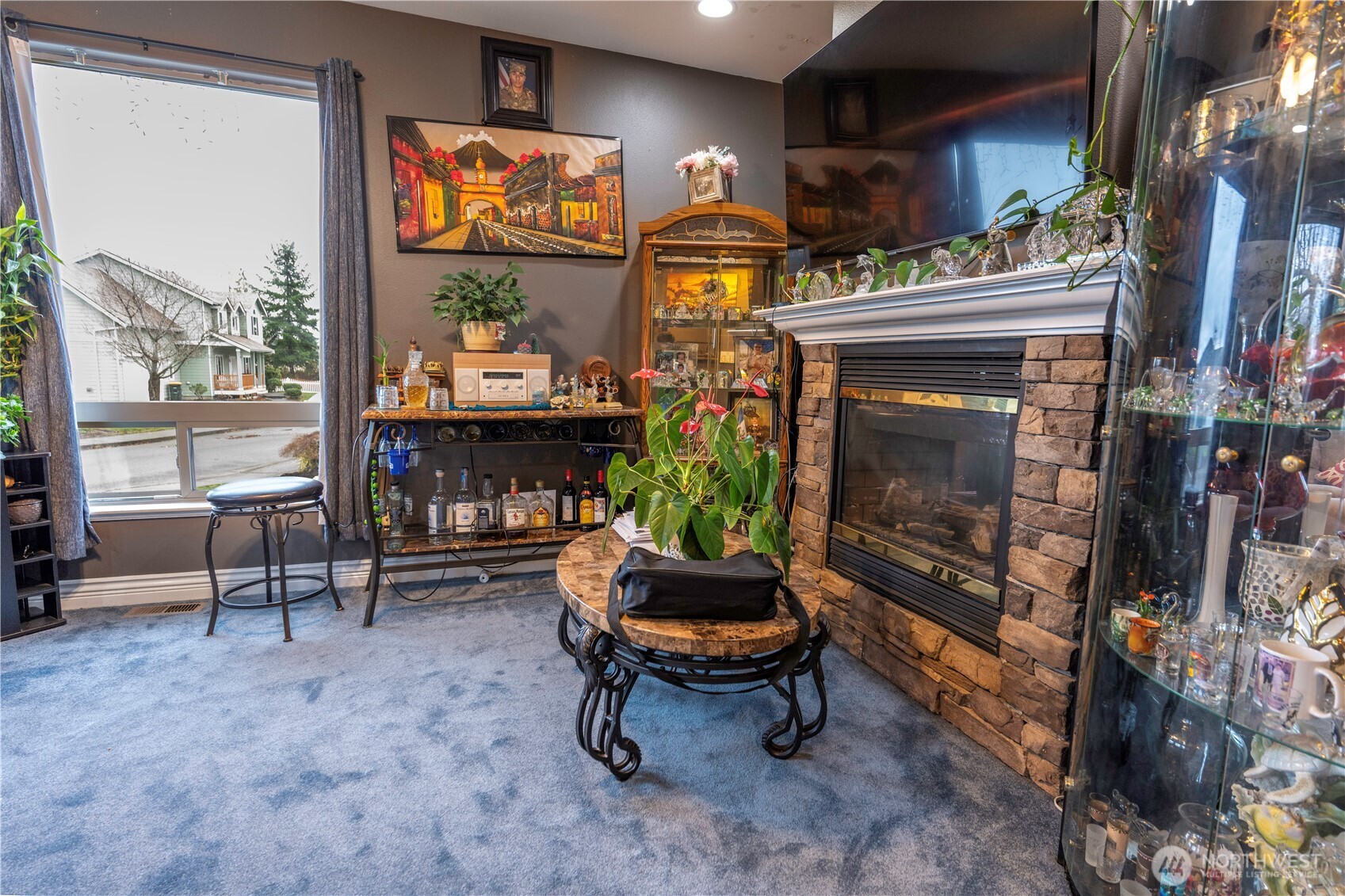 4173 Dover Street Bellingham, WA 98226 - Photo 6 of 40 a living room with furniture a flat screen tv and a fireplace