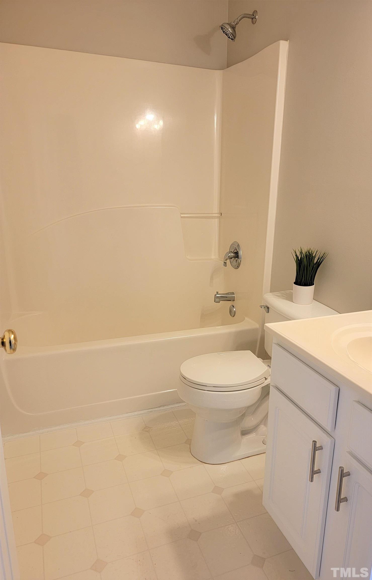 3301 Bellenden Place Raleigh, NC 27604 - Photo 24 of 30 a bathroom with a toilet a sink and bathtub
