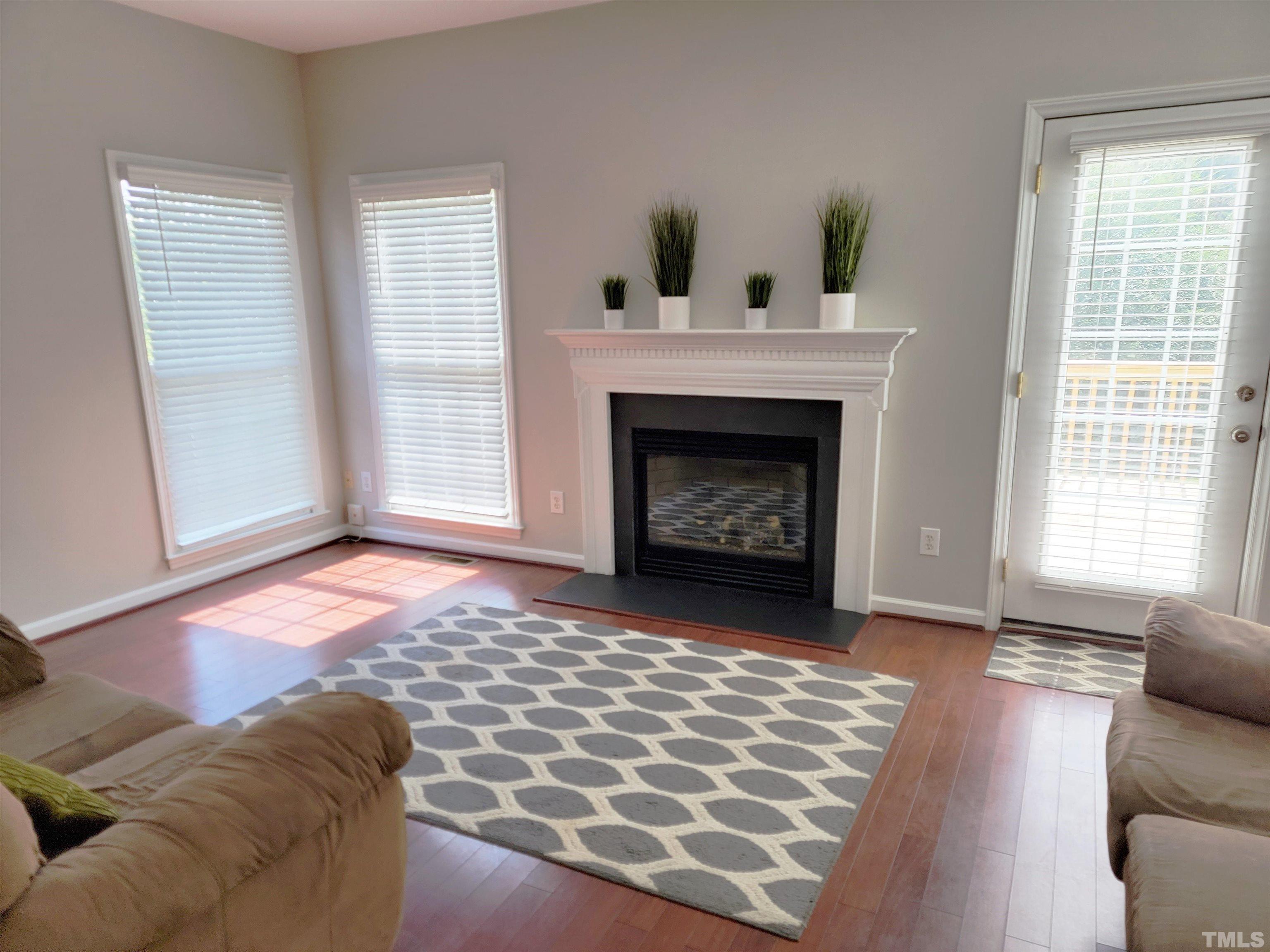3301 Bellenden Place Raleigh, NC 27604 - Photo 4 of 30 a living room with furniture and a fireplace