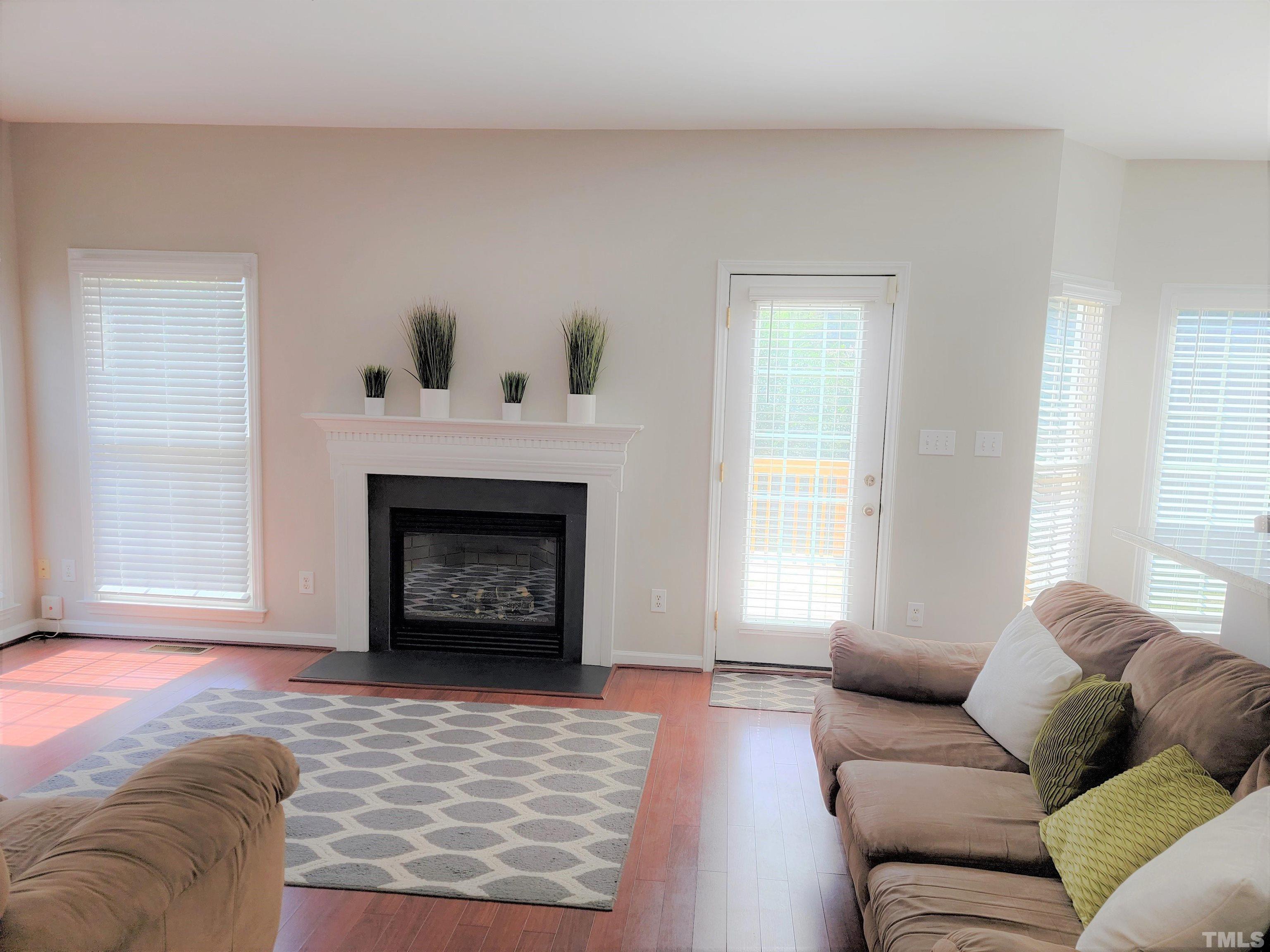 3301 Bellenden Place Raleigh, NC 27604 - Photo 5 of 30 a living room with furniture and a fireplace
