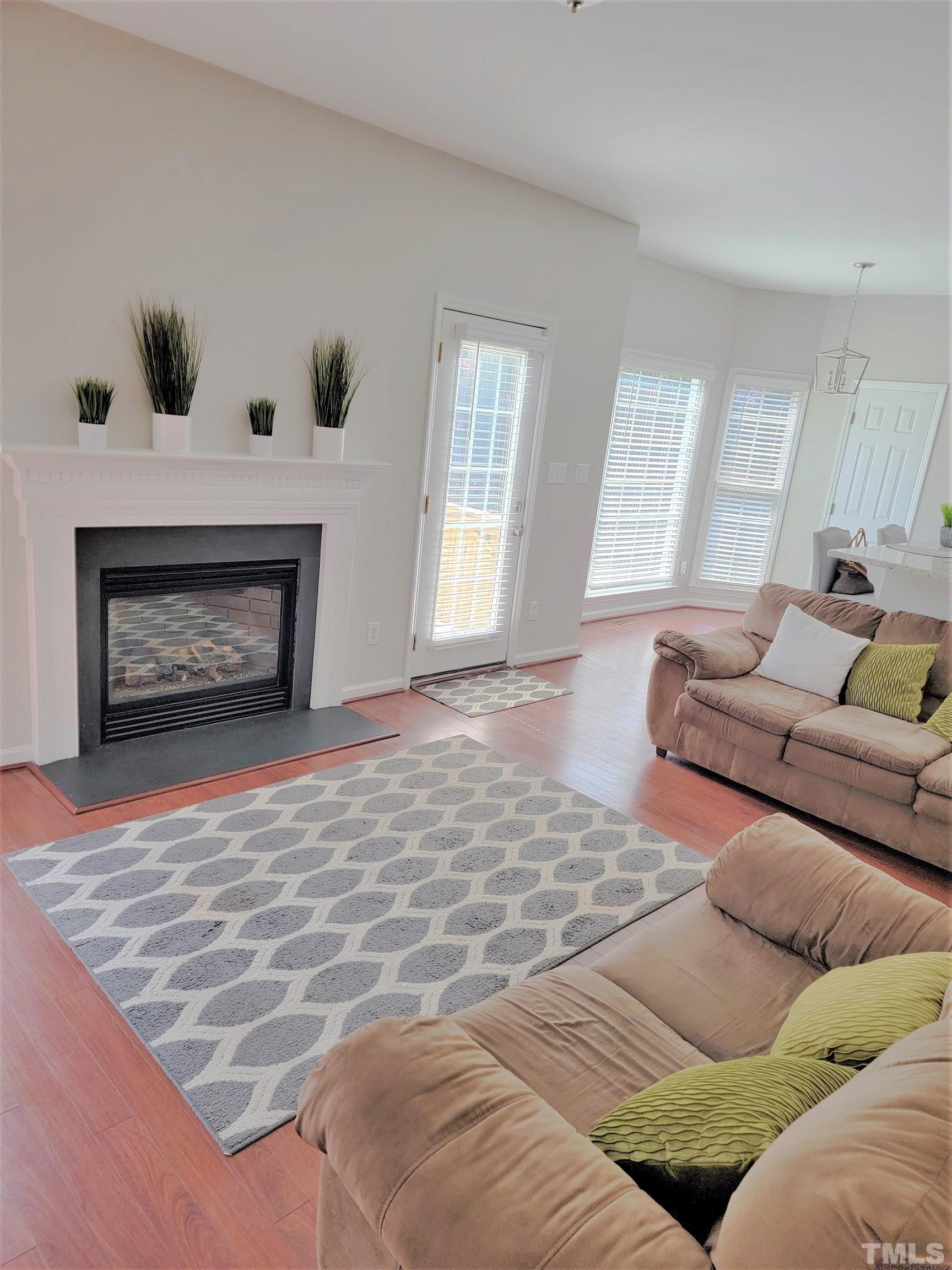 3301 Bellenden Place Raleigh, NC 27604 - Photo 6 of 30 a bedroom with a bed and a fireplace