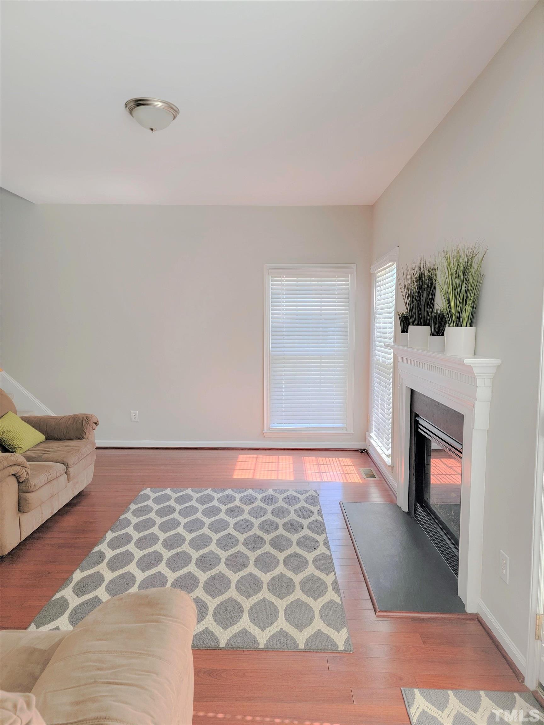 3301 Bellenden Place Raleigh, NC 27604 - Photo 8 of 30 a bedroom with a bed and a fireplace