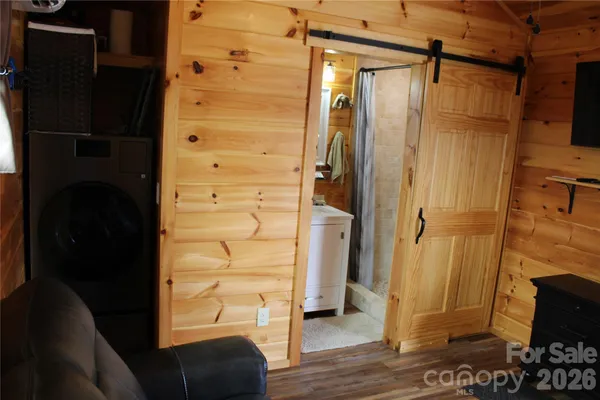 a bathroom with a sink a mirror and shower