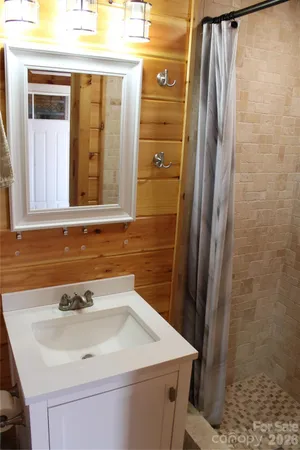 a close view of a sink a microwave and cabinets