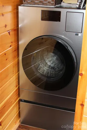 an aerial view of a house with swimming pool and lake view