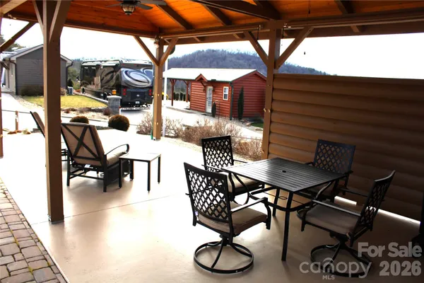 a view of a house with backyard and porch