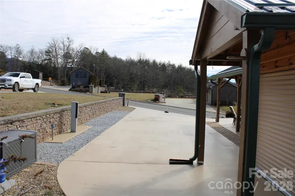 a view of a house with backyard and porch
