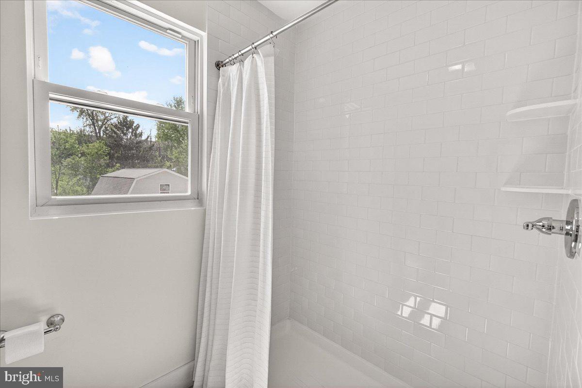 208 East Main Street Middletown, MD 21769 - Photo 20 of 54 White tile in walk-in shower
