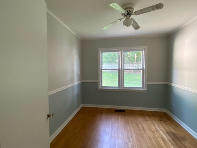 317 South River Road Algonquin, IL 60102 - Photo 5 of 9 an empty room with a window and a fan
