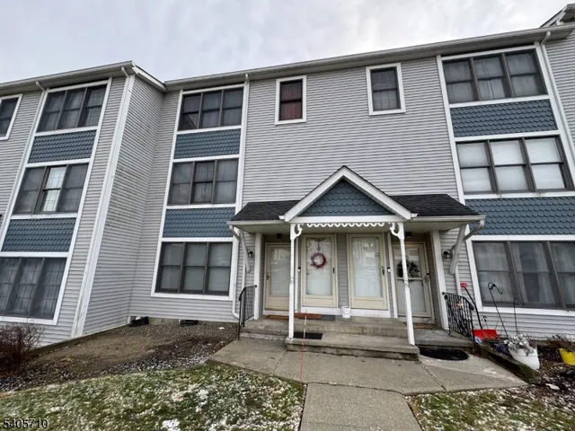 a front view of a house with a garage