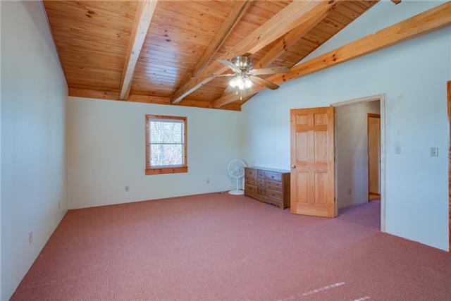 51 Cages Bend Lane Riddleton, TN 37151 - Photo 14 of 20 a view of a livingroom with a ceiling fan and window