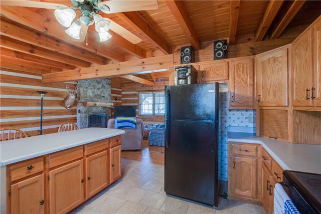 51 Cages Bend Lane Riddleton, TN 37151 - Photo 10 of 20 a kitchen with refrigerator and cabinets