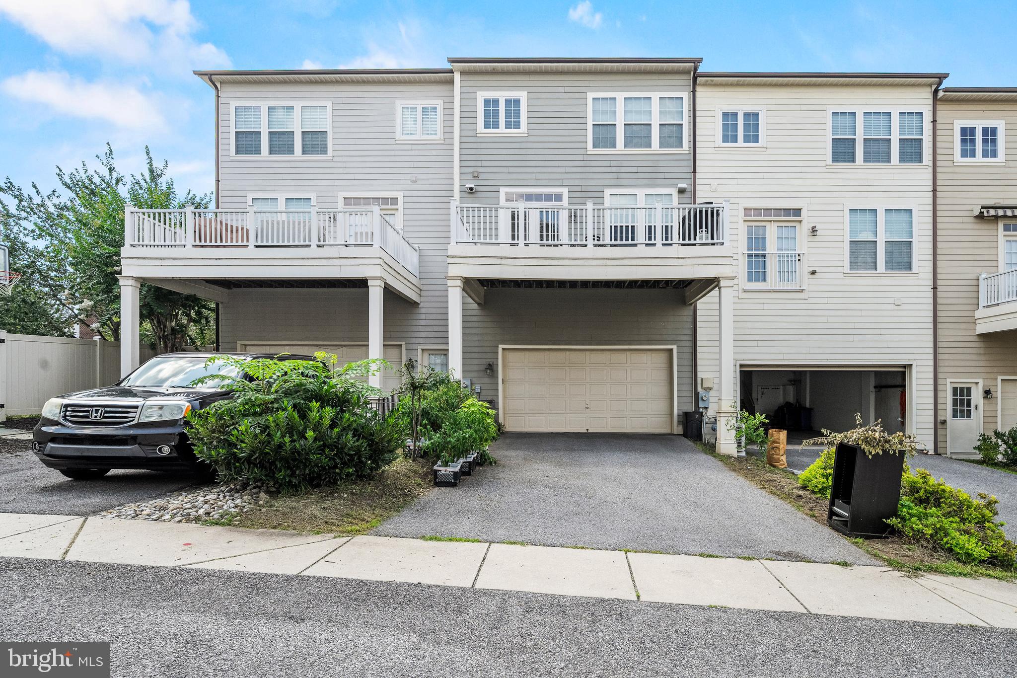 7704 Water Street Fulton, MD 20759 - Photo 2 of 45 a front view of a house with a garden and parking