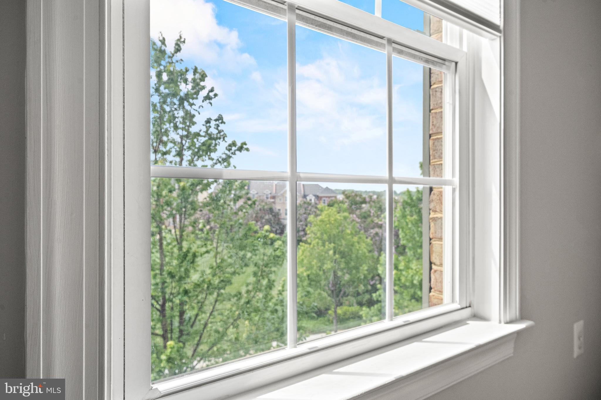 7704 Water Street Fulton, MD 20759 - Photo 22 of 45 a view of a room that has a large window and a potted plant