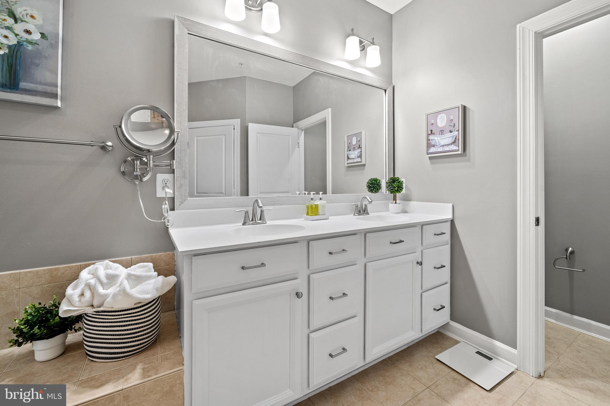 7704 Water Street Fulton, MD 20759 - Photo 23 of 45 a bathroom with a sink and a mirror