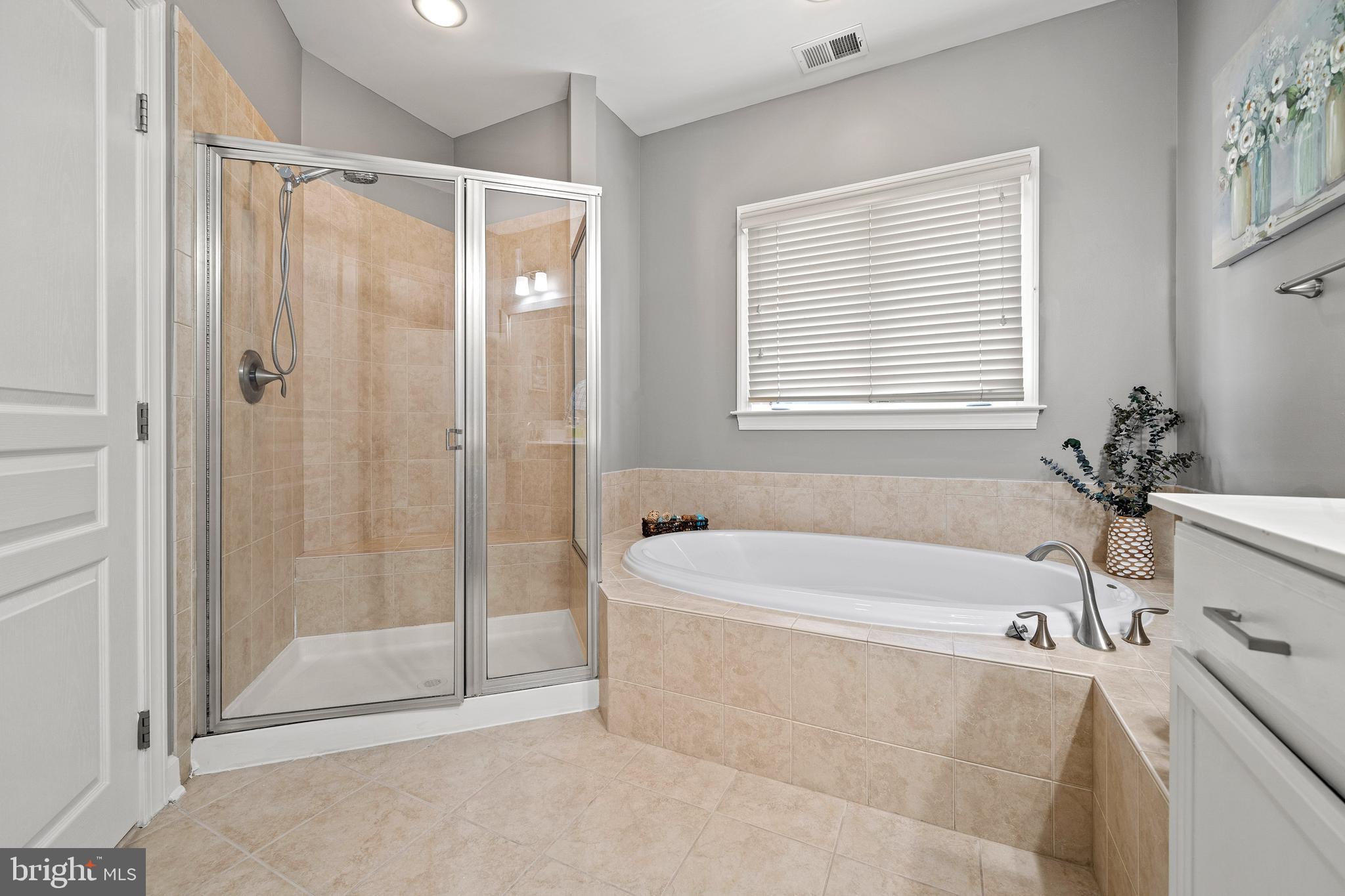 7704 Water Street Fulton, MD 20759 - Photo 25 of 45 a white bath tub sitting next to a shower