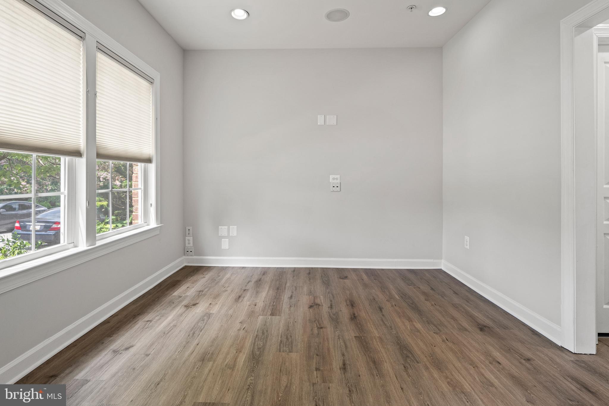 7704 Water Street Fulton, MD 20759 - Photo 28 of 45 an empty room with wooden floor and windows
