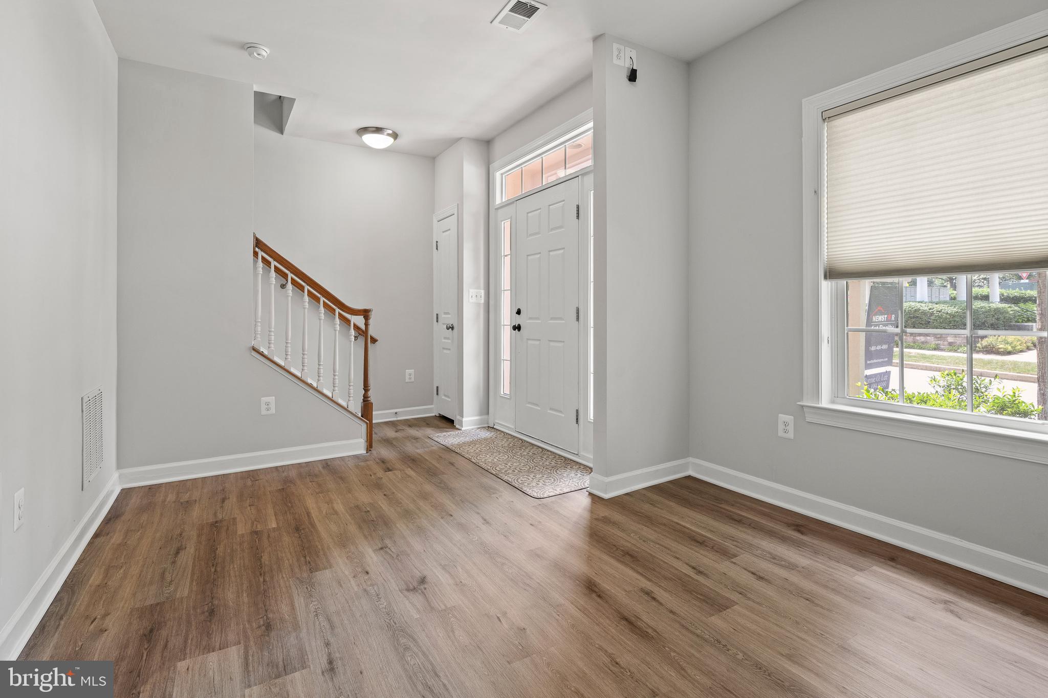 7704 Water Street Fulton, MD 20759 - Photo 29 of 45 a view of an empty room with wooden floor and a window