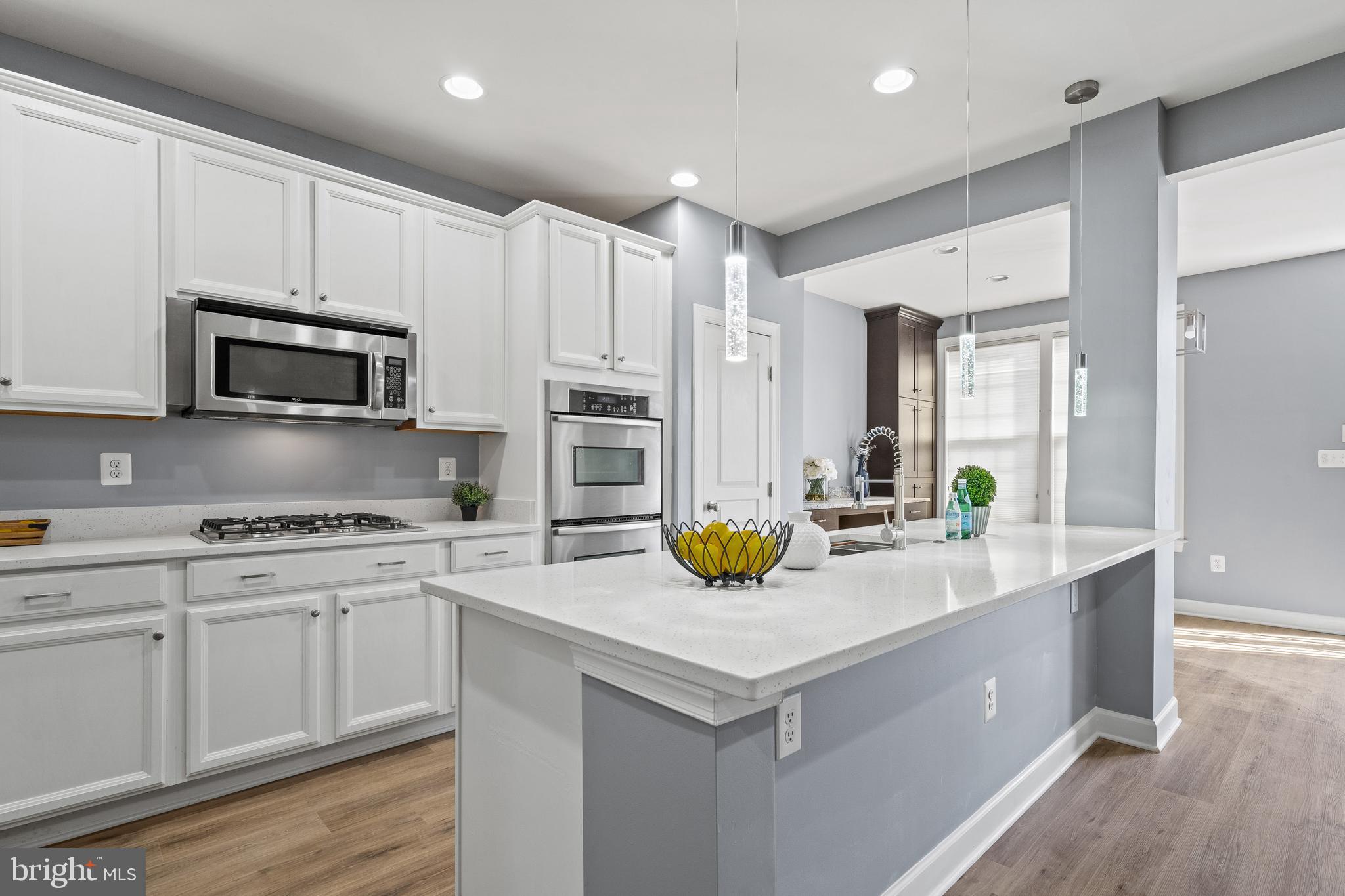 7704 Water Street Fulton, MD 20759 - Photo 3 of 45 a kitchen with stainless steel appliances granite countertop a sink a stove and cabinets