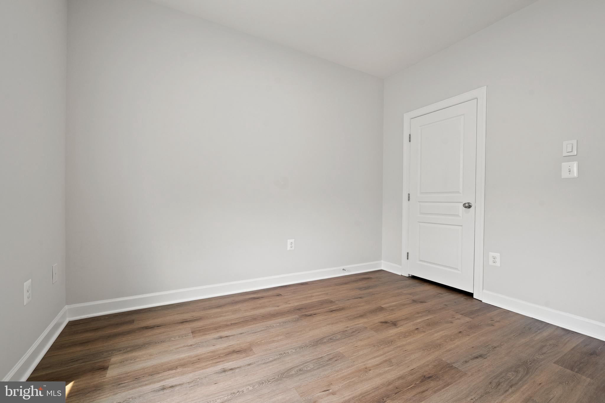 7704 Water Street Fulton, MD 20759 - Photo 32 of 45 a view of an empty room with wooden floor