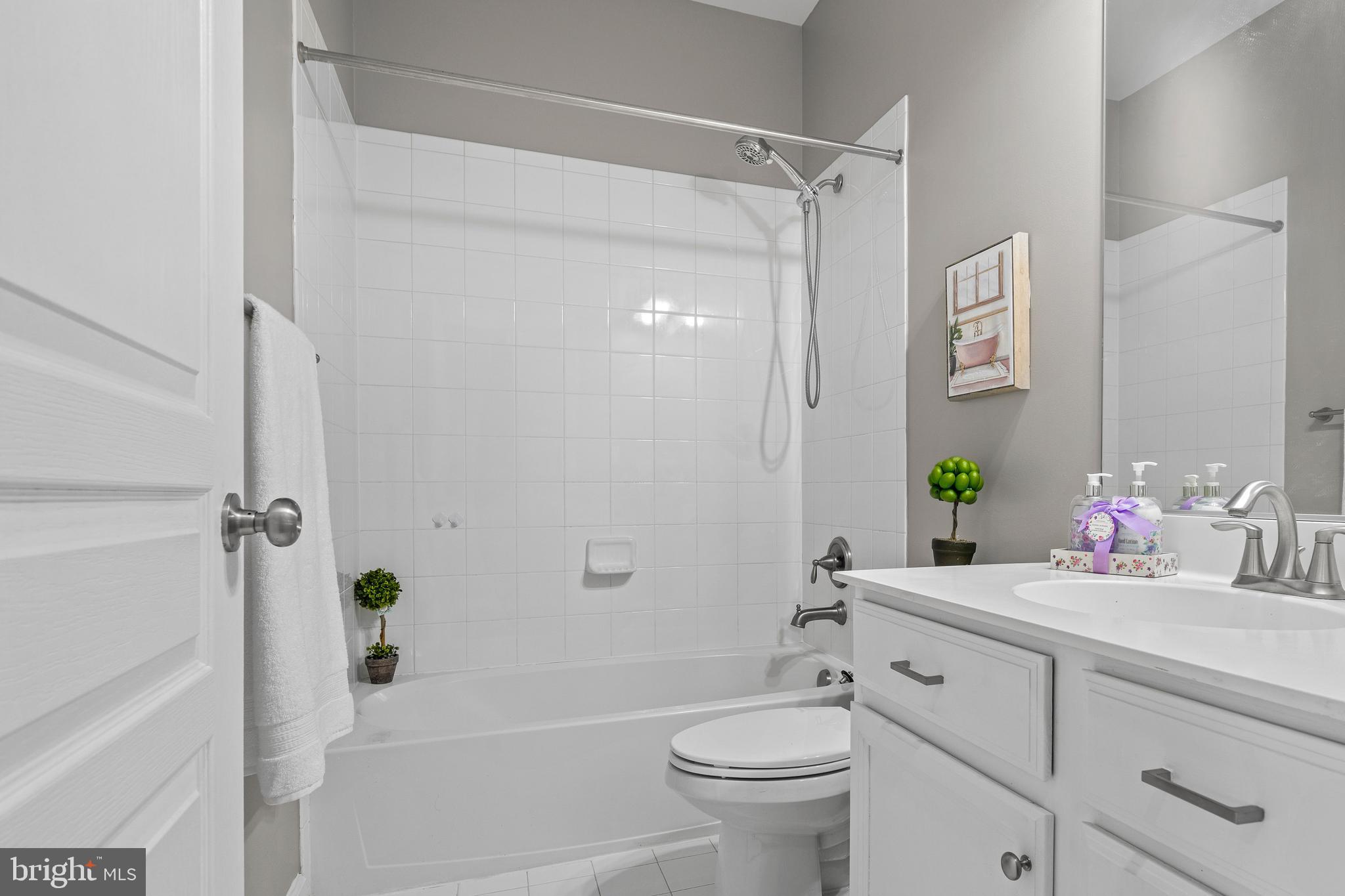 7704 Water Street Fulton, MD 20759 - Photo 33 of 45 a bathroom with a sink toilet and shower
