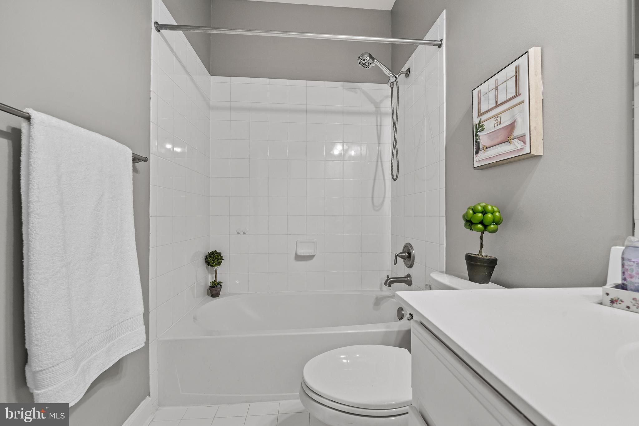 7704 Water Street Fulton, MD 20759 - Photo 34 of 45 a bathroom with a sink a toilet and shower
