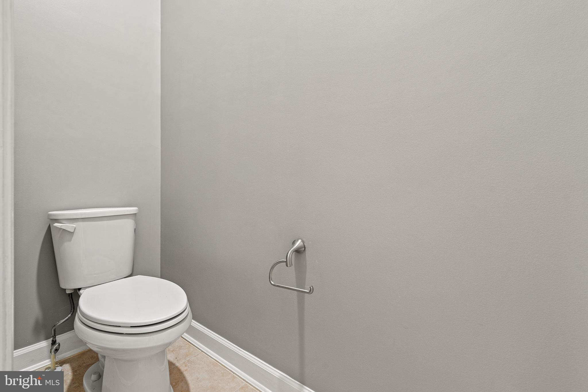 7704 Water Street Fulton, MD 20759 - Photo 35 of 45 a white toilet sitting next to a shower