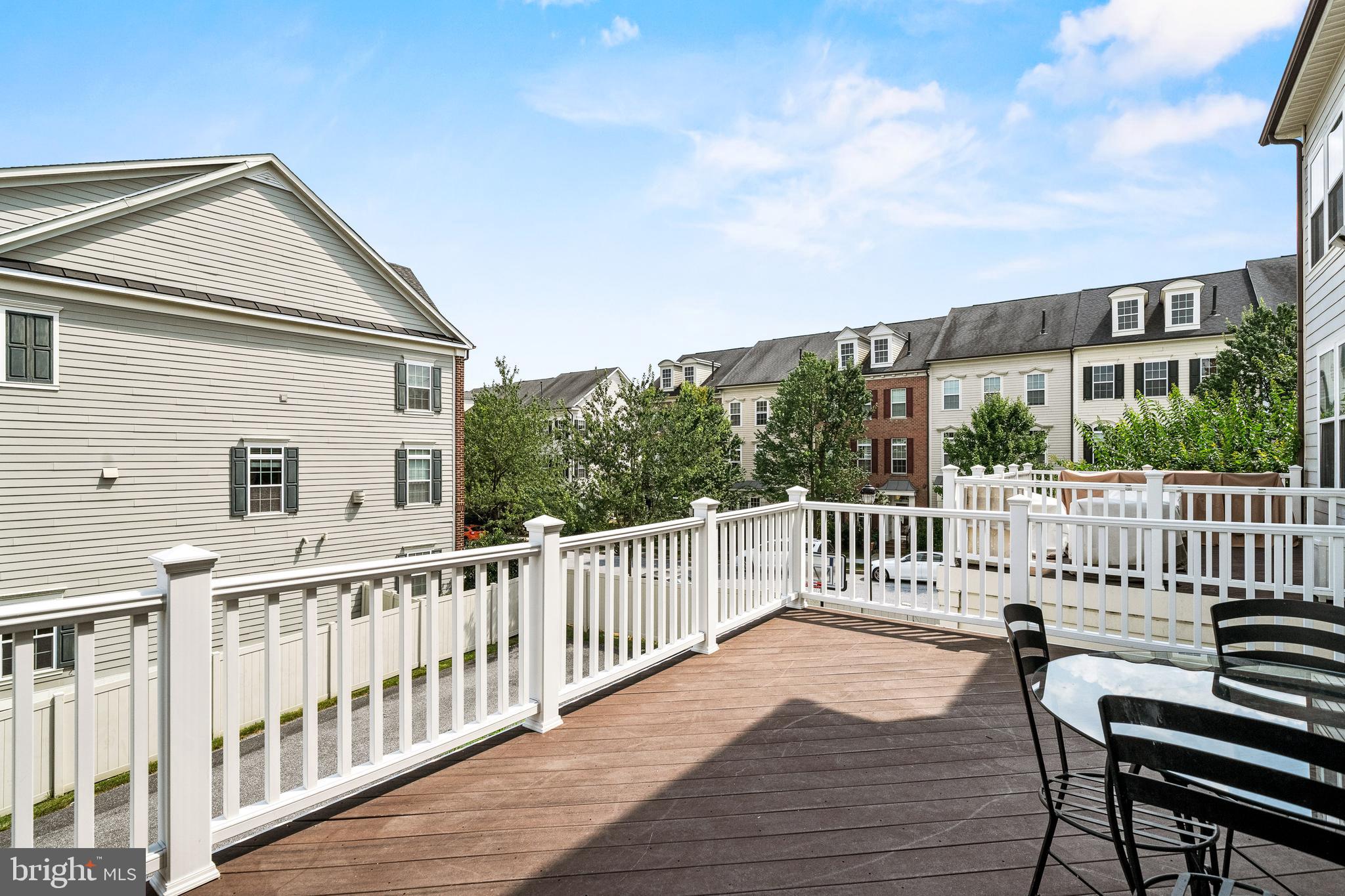 7704 Water Street Fulton, MD 20759 - Photo 37 of 45 a view of a deck with a chair and wooden floor