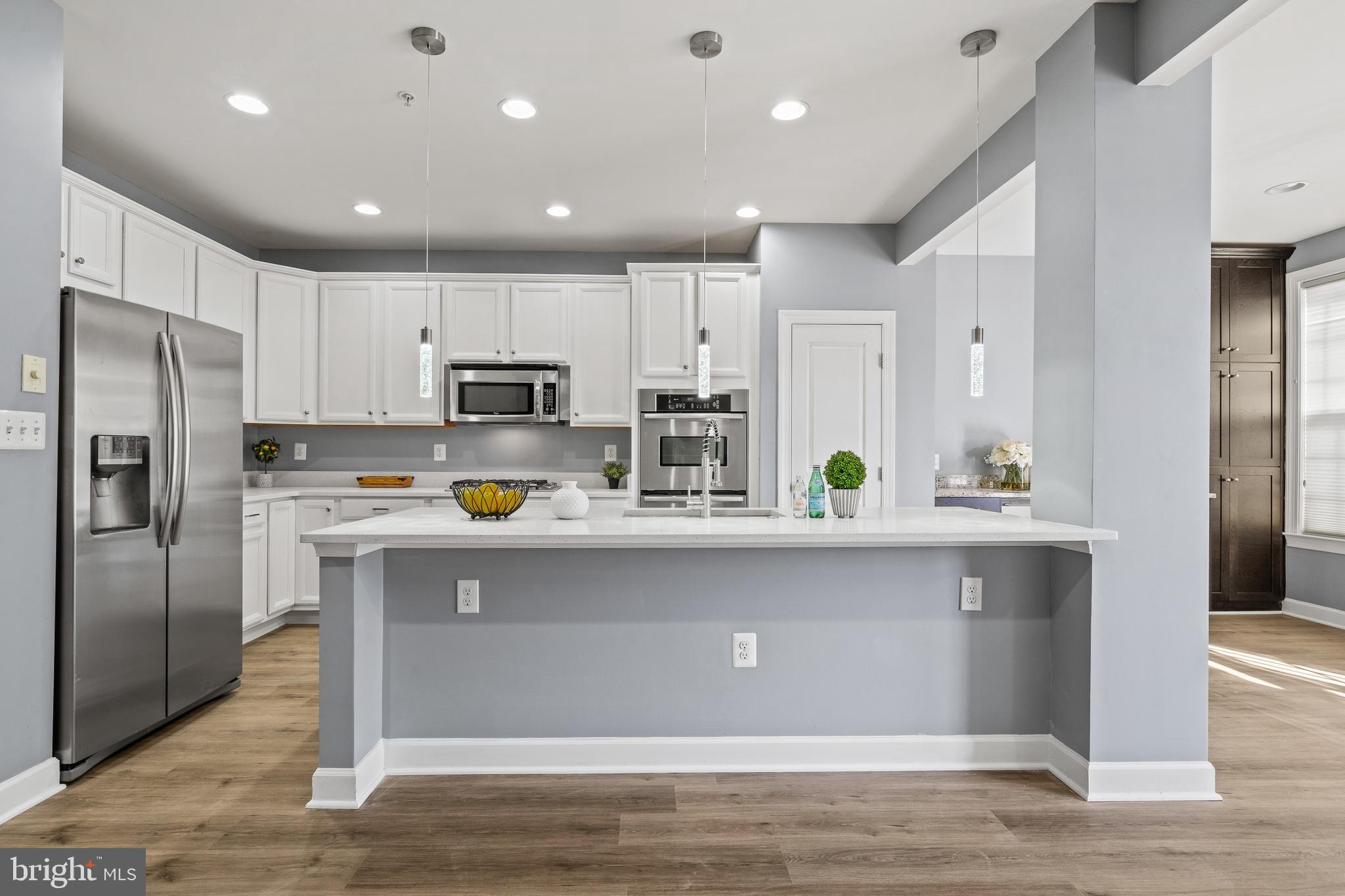 7704 Water Street Fulton, MD 20759 - Photo 4 of 45 a kitchen with stainless steel appliances a refrigerator sink and microwave
