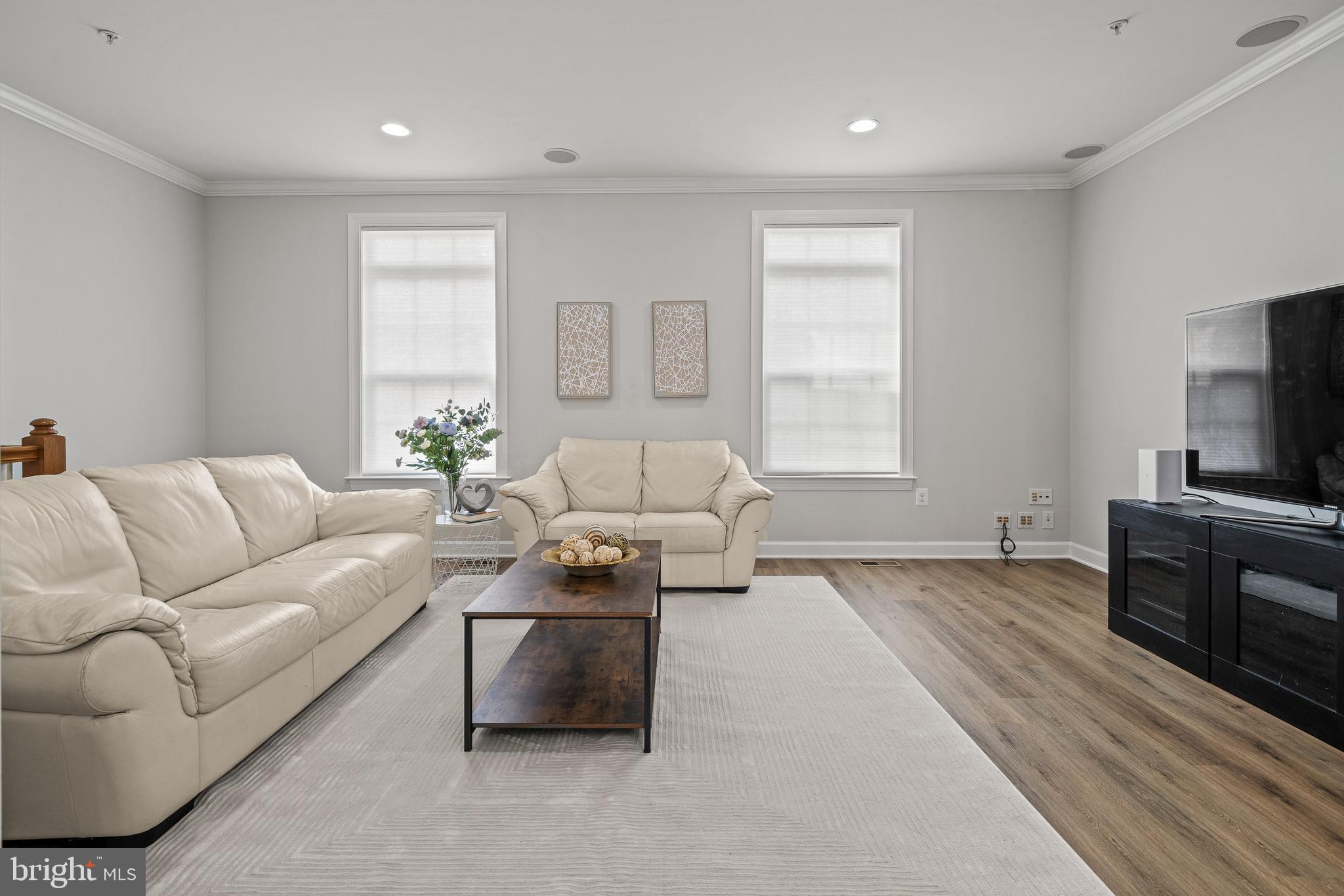 7704 Water Street Fulton, MD 20759 - Photo 10 of 45 a living room with furniture and a flat screen tv