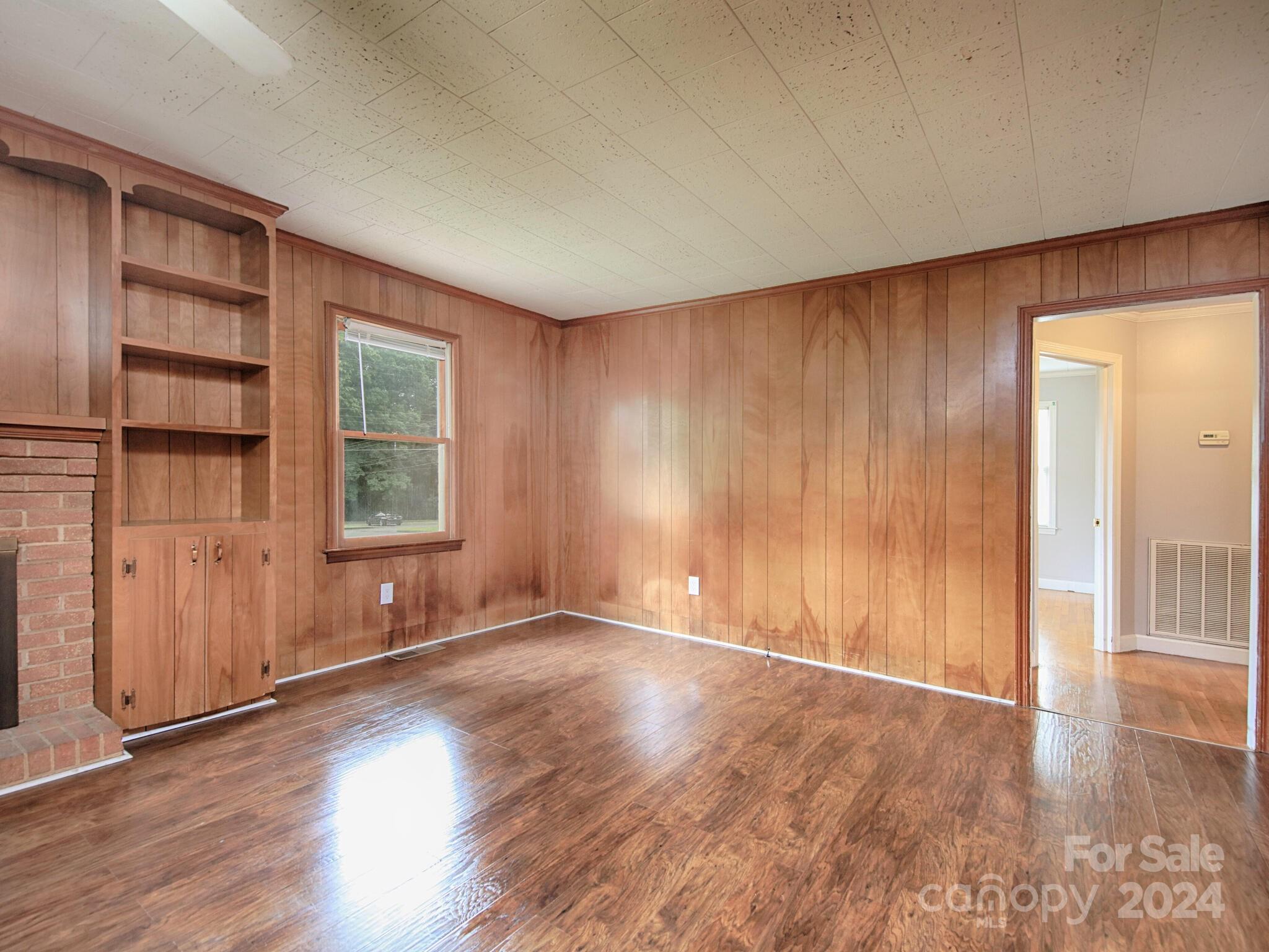 446 Fieldstone Road Mooresville, NC 28115 - Photo 11 of 30 an empty room with wooden floor and windows